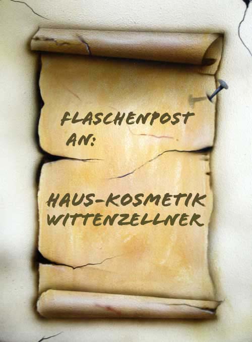 Alte aufgerollte Papierrolle mit der Aufschrift: Flaschenpost an Haus-Kosmetik Witti
